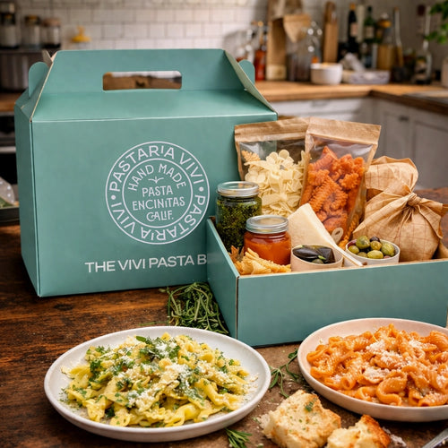 Vivi Pasta subscription box with pasta dishes and ingredients on a wooden table